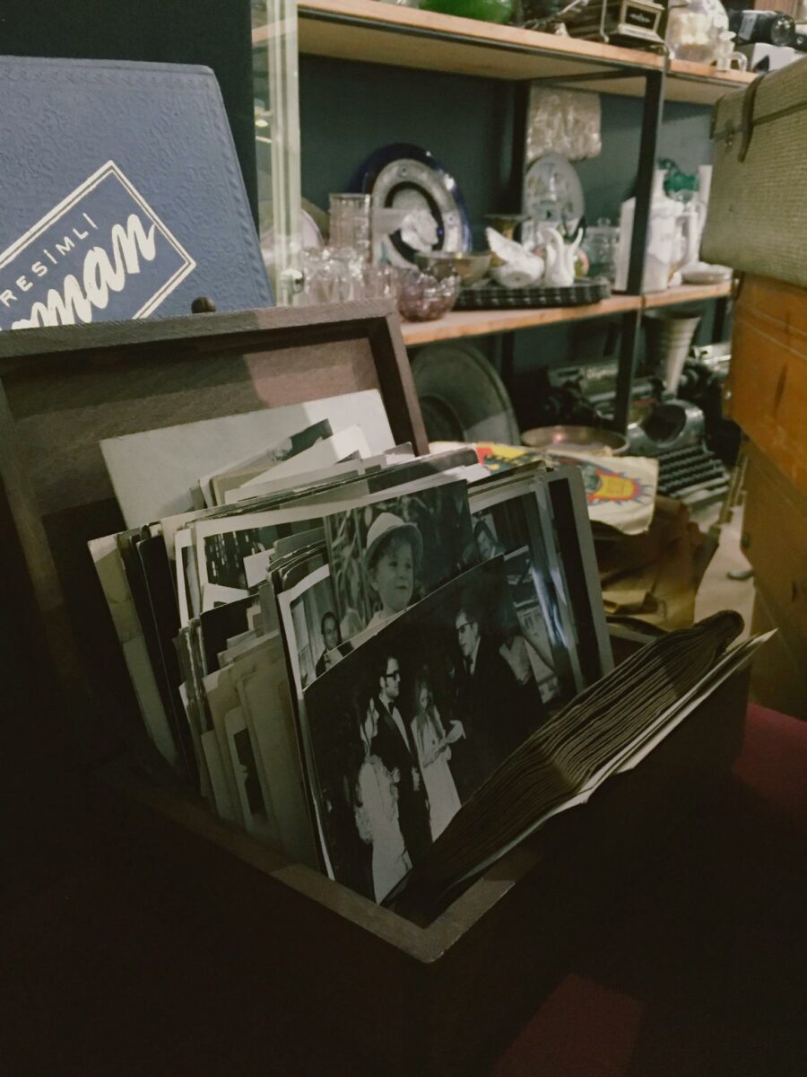 A nostalgic collection of vintage photos in a wooden box at a Beyoğlu shop.