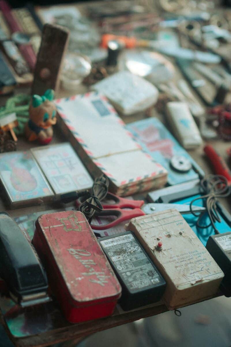 Assorted vintage items on a market table showcasing timeless collectibles.